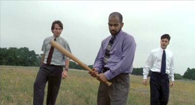 That bloody printer finally meets a worthy end in a Casino-style baseball bat attack in a field, accompanied by some nice angry rap music. Niiiiiice... Office Space image