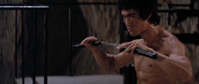 Bruce never did mind taking a little stick. Enter the Dragon image