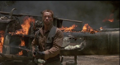 Arnie blows some shit up. He's really rather good at that. Predator image