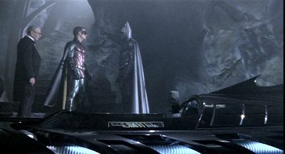 Batman and Robin compare their sleek rubber outfits. Batman Forever
